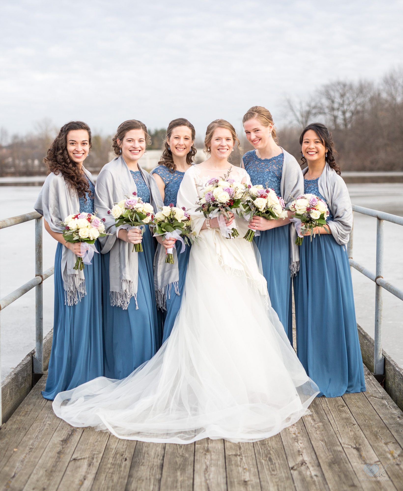 Winter wedding photographs on a dock in Plymouth, Michigan