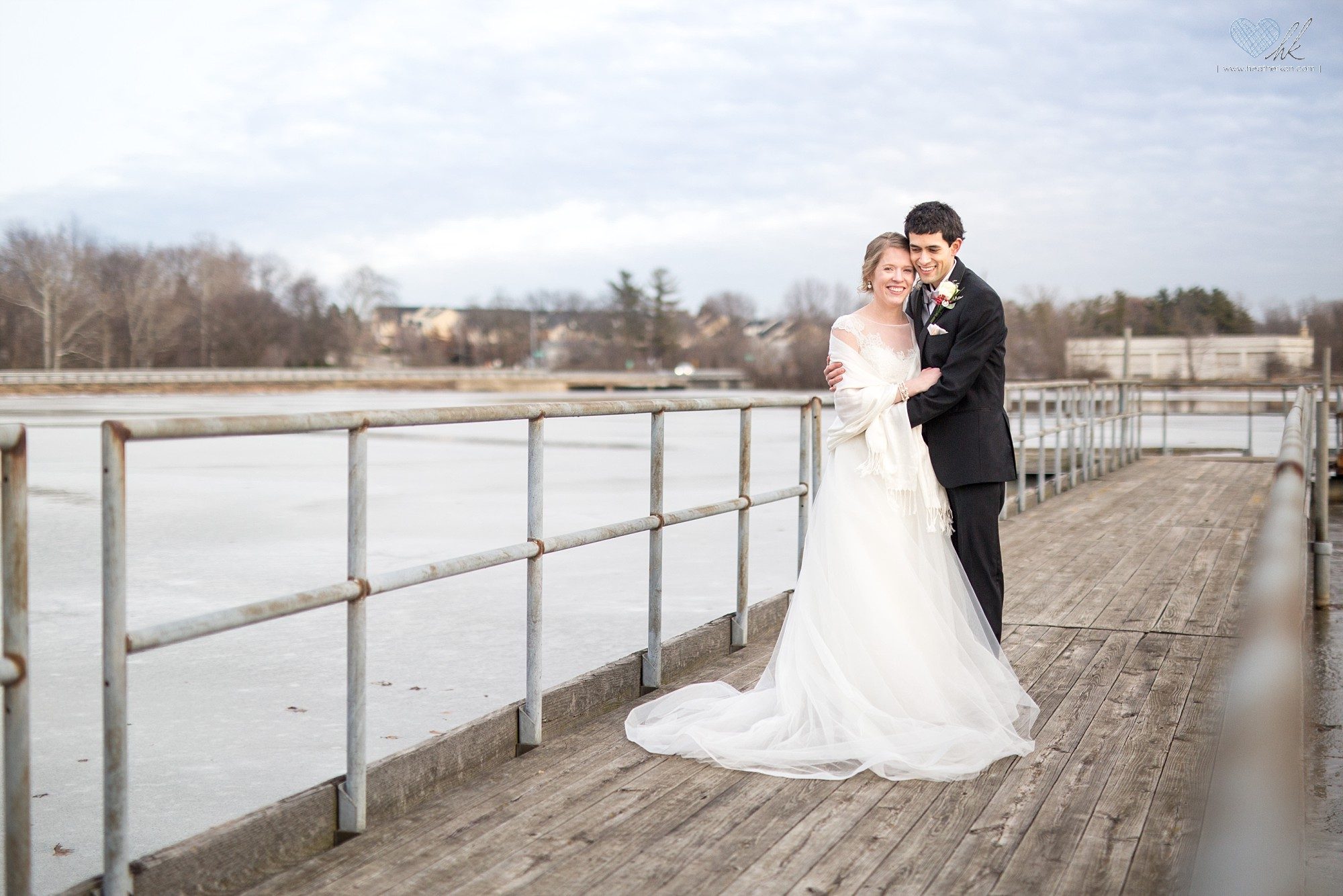 Winter wedding photographs on a dock in Plymouth, Michigan