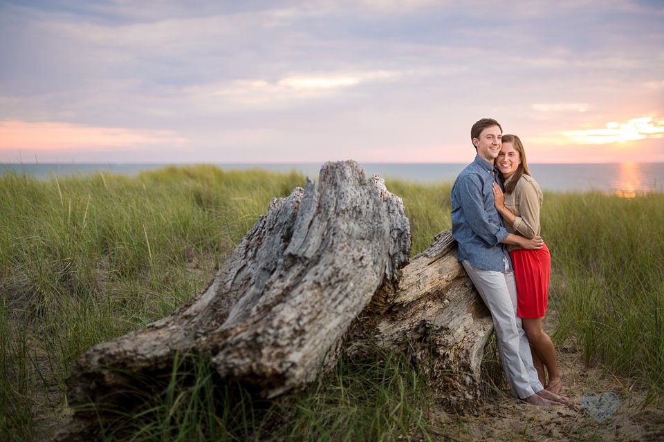 Grand Haven beach sunset engagement photographs in the water