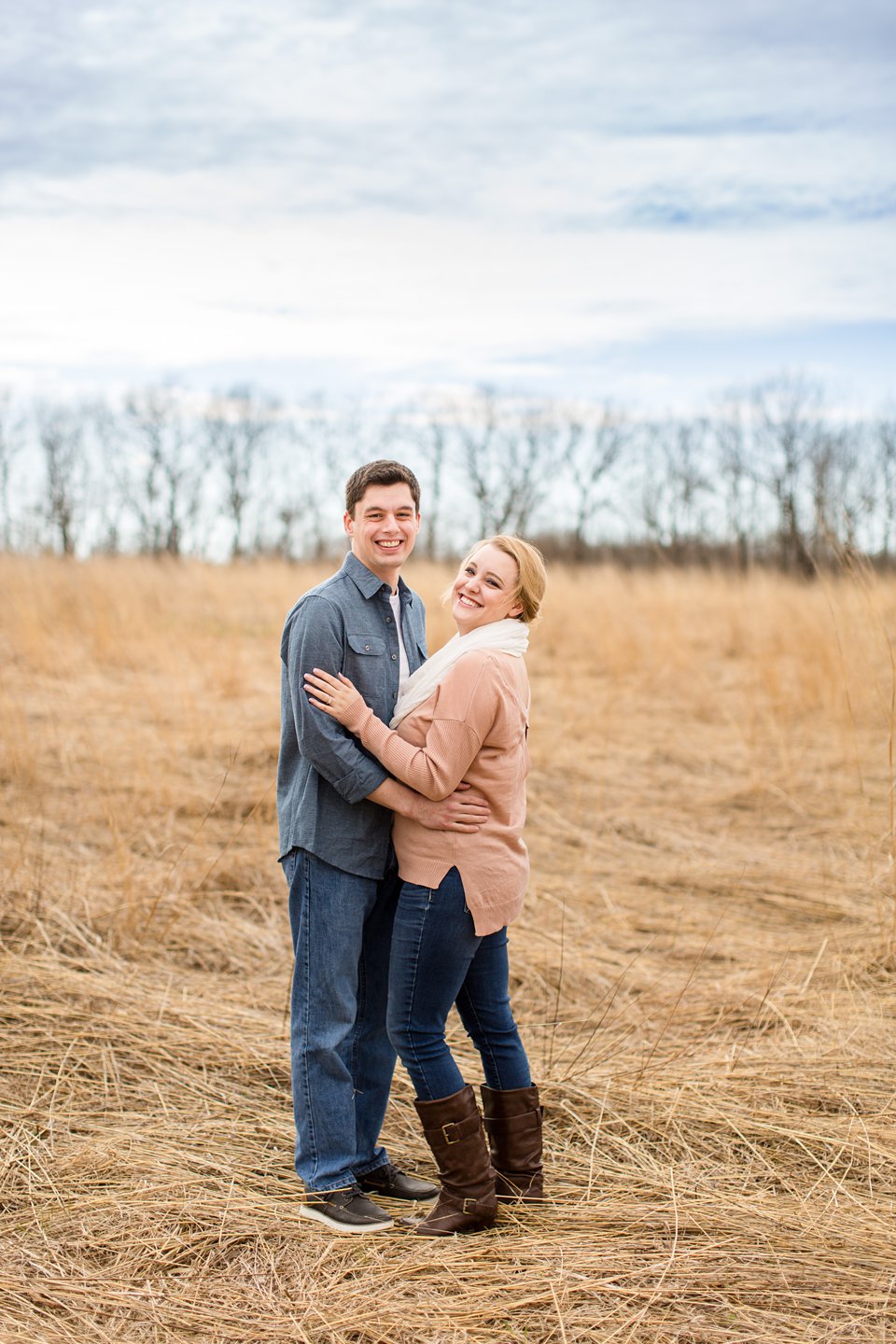 Spring engagement photographs in field Michigan