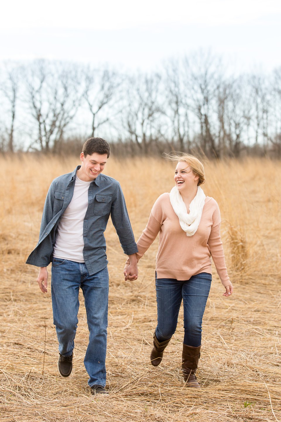 Spring engagement photographs in field Michigan