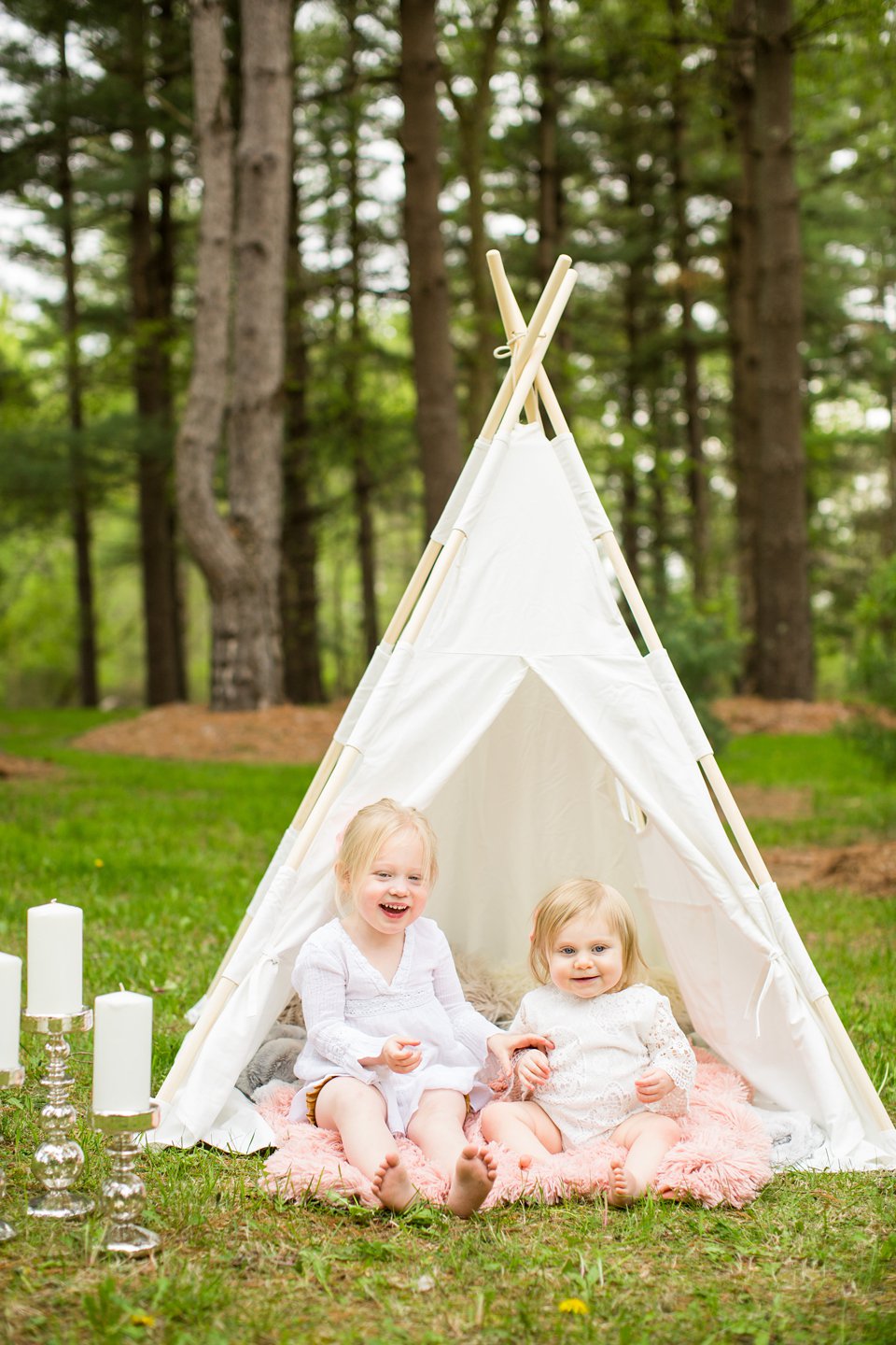 Teepee photo session with toddler sisters