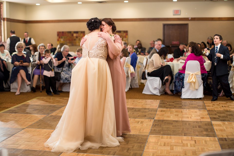 Okemos Conference Center wedding reception photographs on the dancefloor