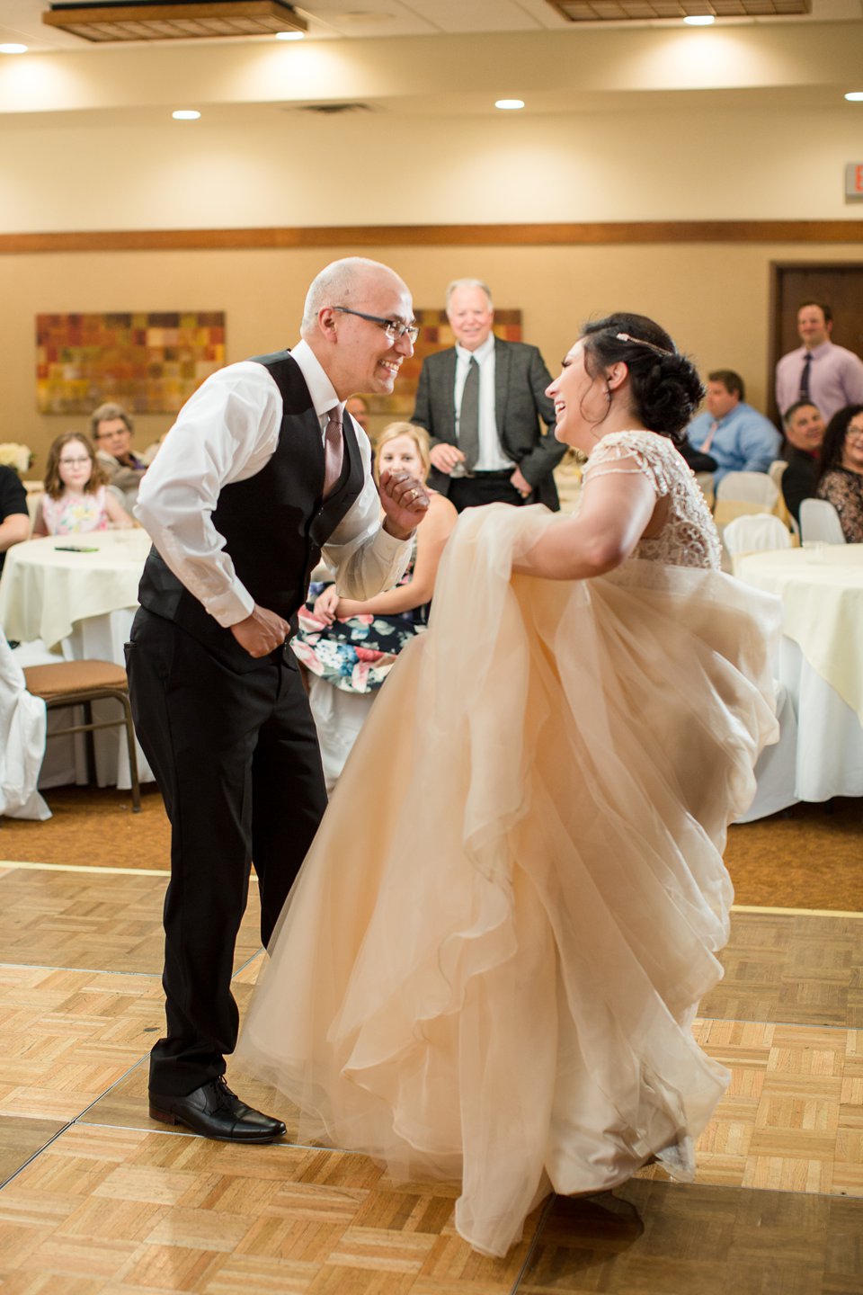 Okemos Conference Center wedding reception photographs on the dancefloor