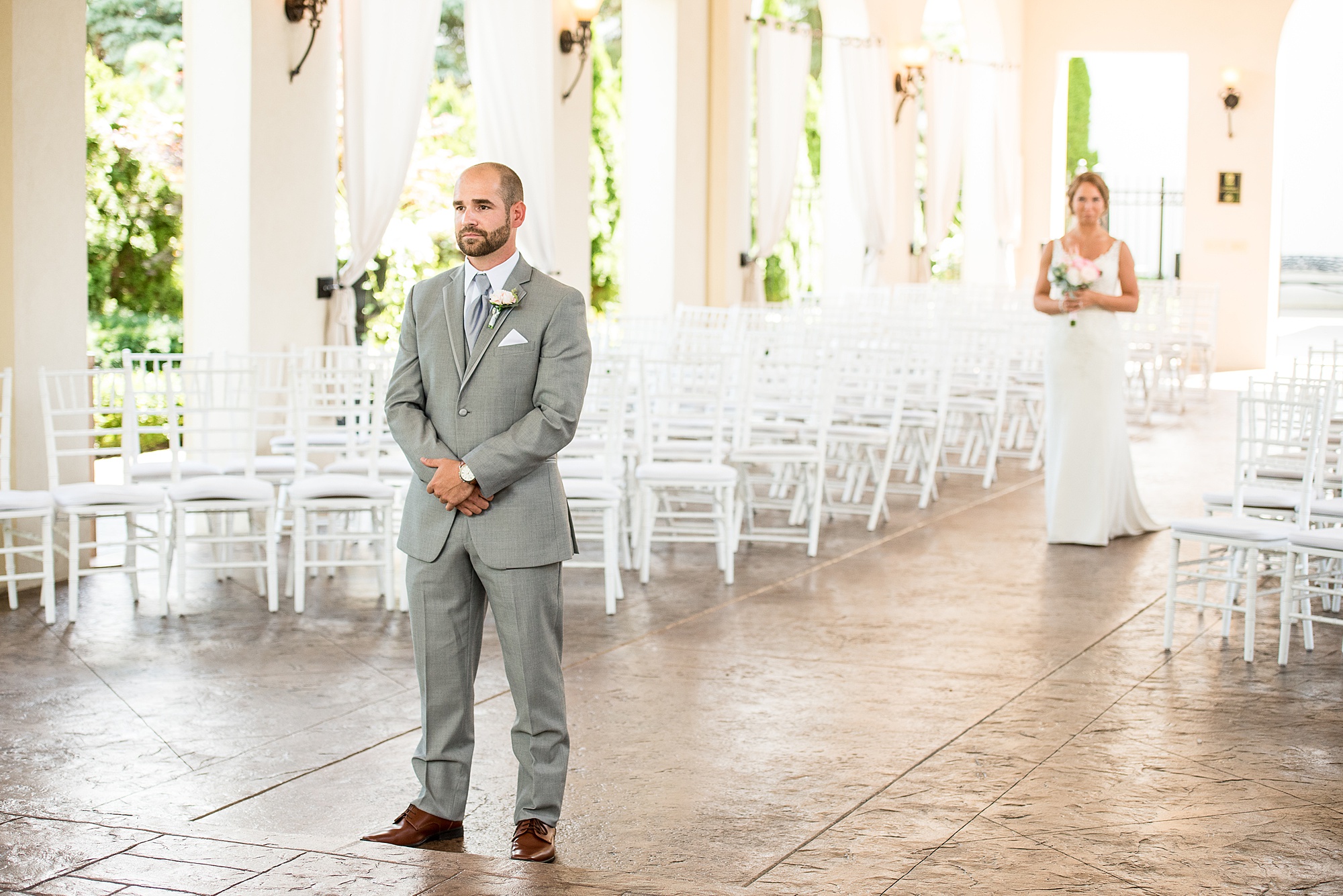 First look between bride and groom at the Crystal Gardens Event Center in Howell, Michgan