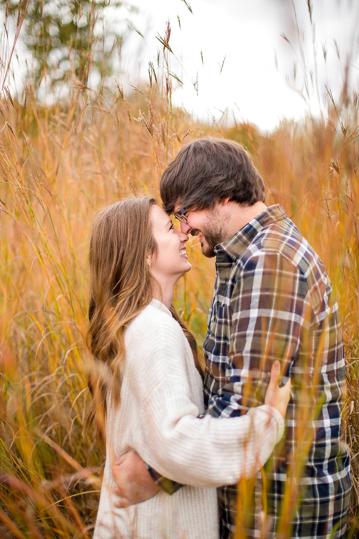 Fall engagement photographs in tall red grass, Grand Ledge, Michigan
