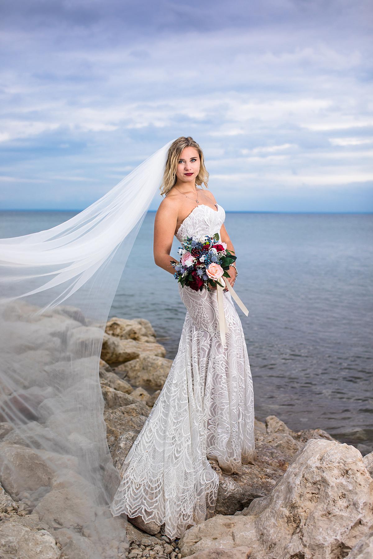 Destination wedding photographs in Mackinaw City, Michigan at the beach