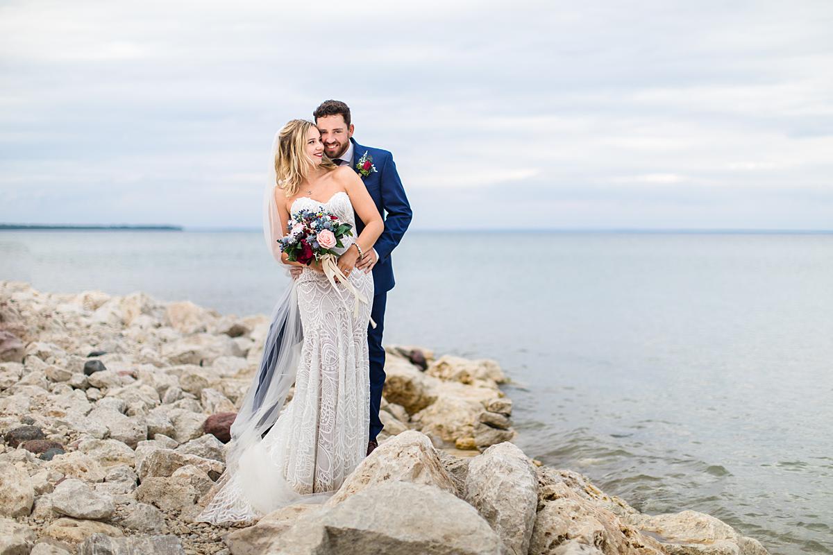 Destination wedding photographs in Mackinaw City, Michigan at the beach