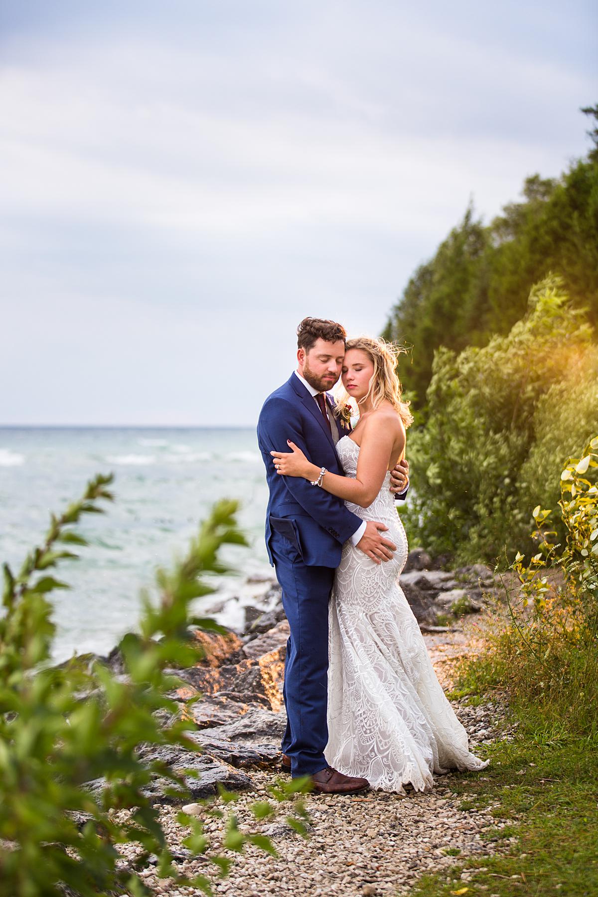 Destination wedding photographs in Mackinaw City, Michigan at the beach