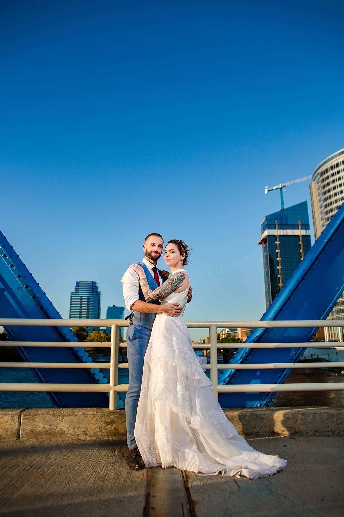 Wedding photographs at sunset on the Blue Bridge in Grand Rapids Michigan