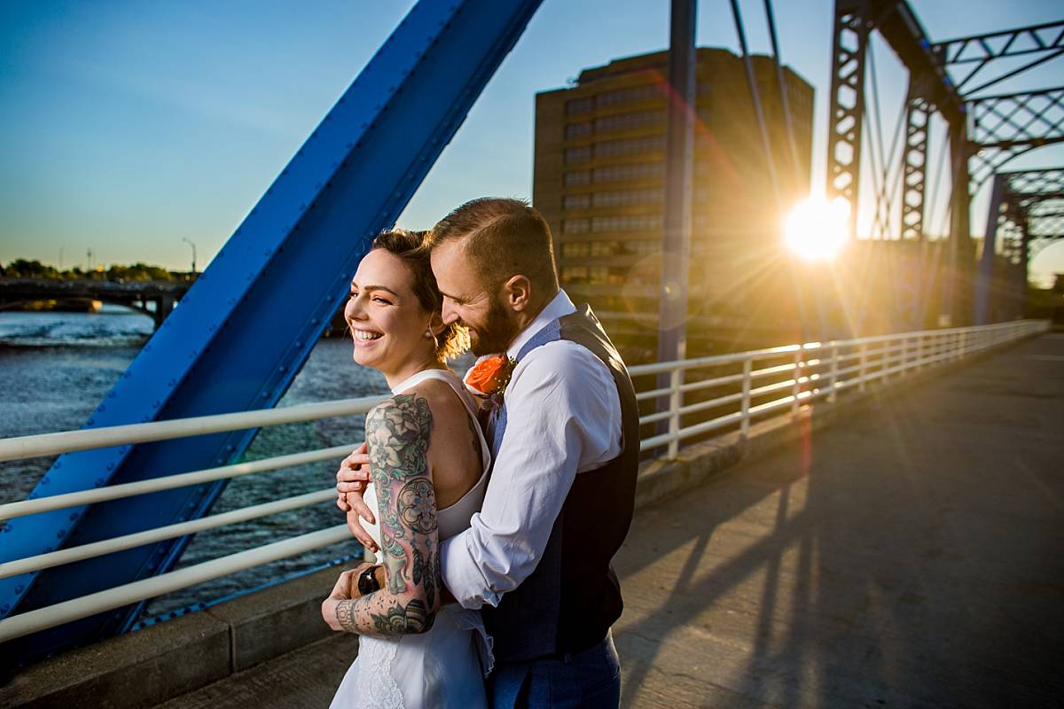 Wedding photographs at sunset on the Blue Bridge in Grand Rapids Michigan