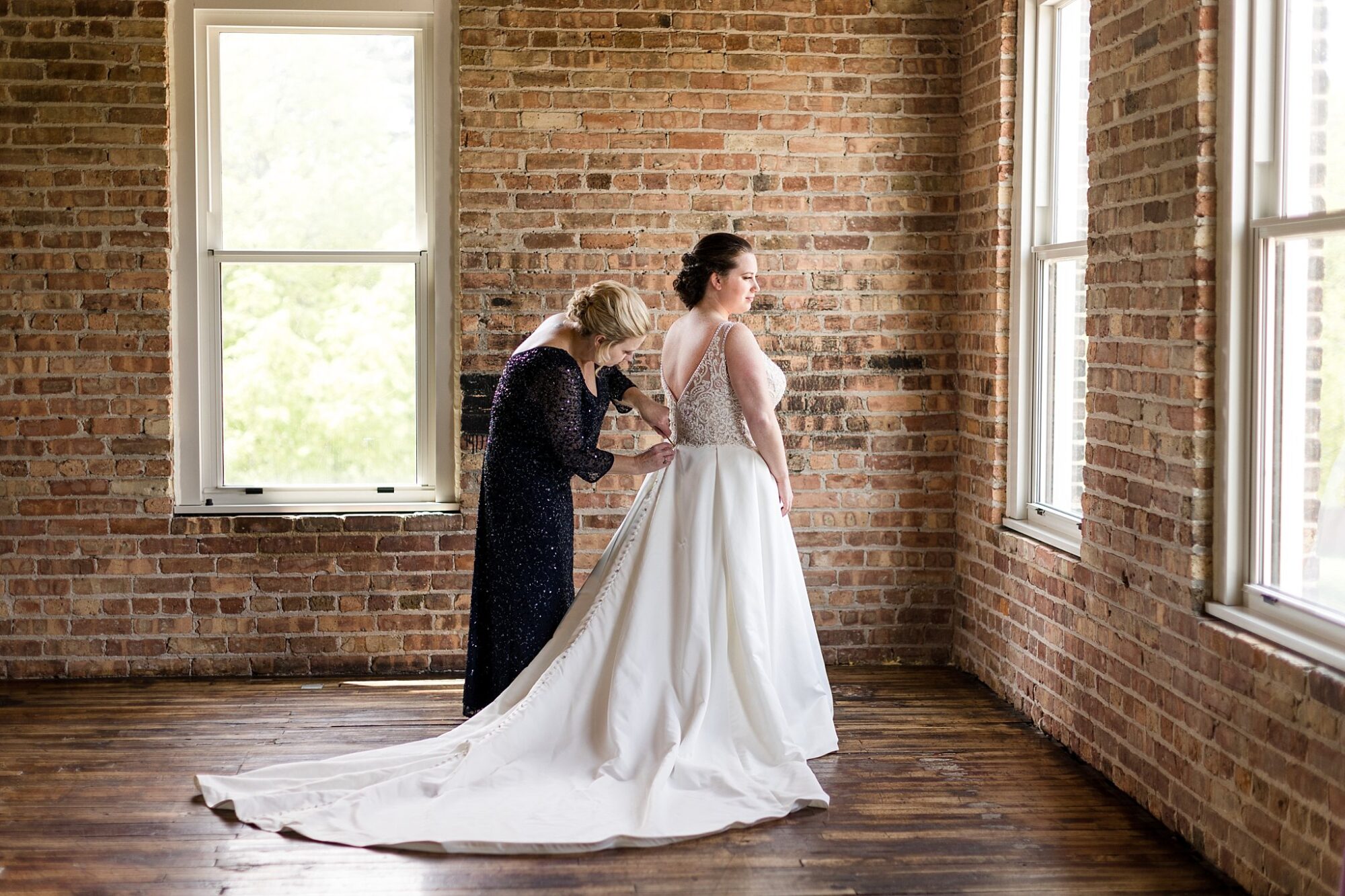 Record Box loft bride getting ready near window