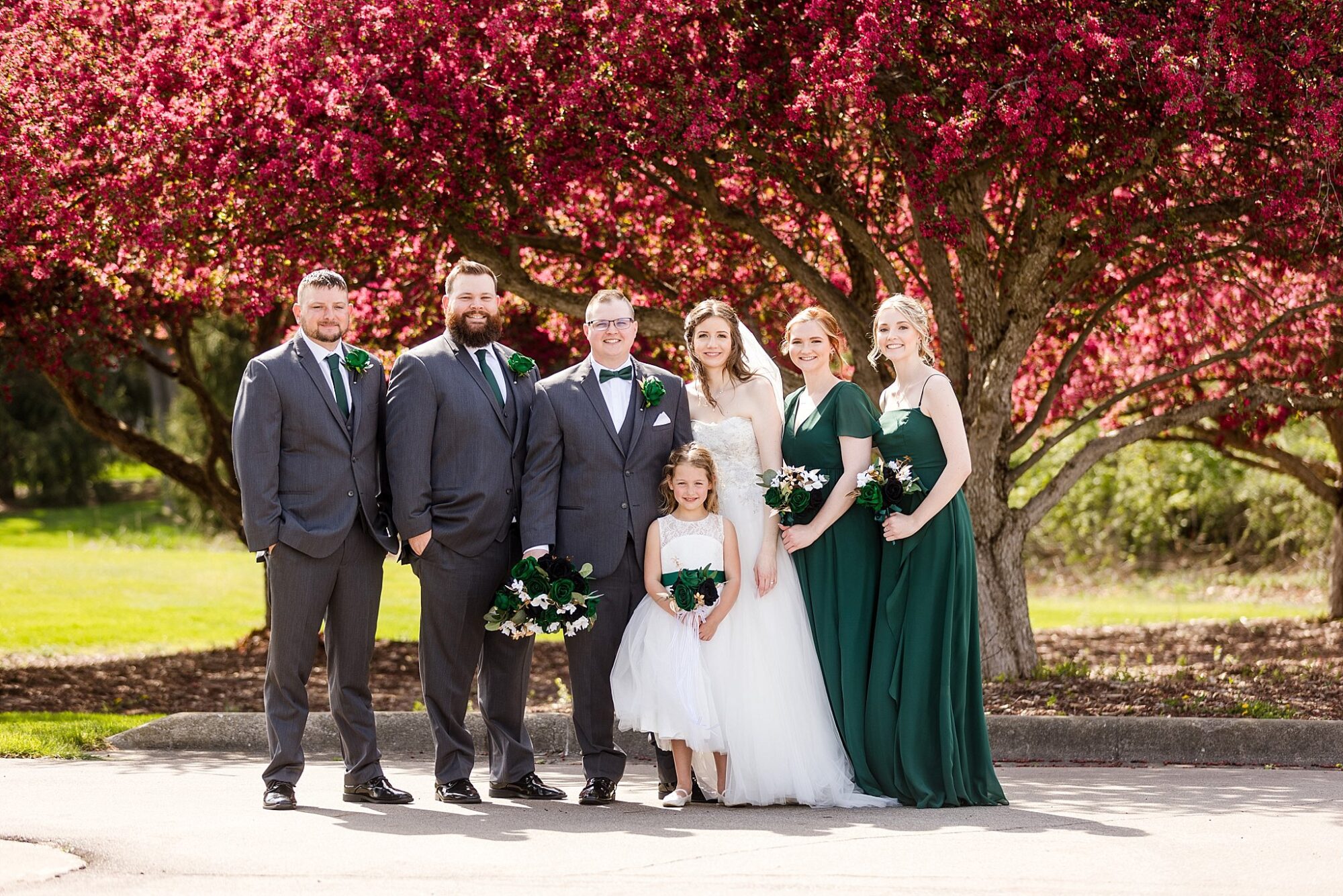 Wedding photographs under flowering trees at Hawk Hollow in Bath Michigan